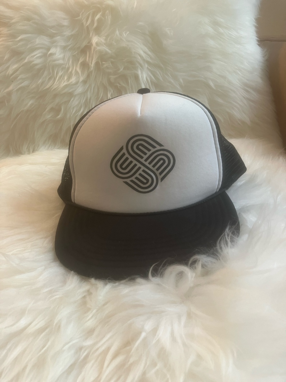 Black & White Trucker Hat with Geometric Emblem